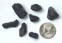 Apache tears with half dollar to show size